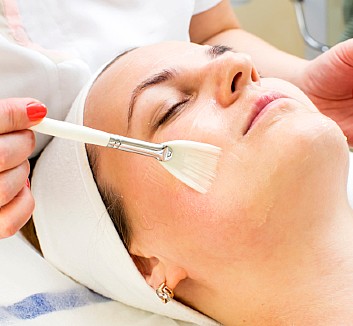 Woman getting facial procedure